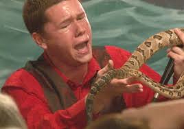 Pastor Andrew Hamblin handles a venomous snake during Friday night&#39;s service. (Photo: WBIR) - 1384579746000-Still1116-00001