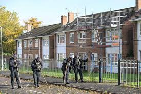 Man, 30, shot dead on road outside block of flats as cops launch murder probe