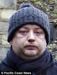 Boy George heads out of his London home January 2009. Before jail: A glum-faced Boy George days before he was sentenced in January - article-1180468-030E33D3000005DC-727_233x302
