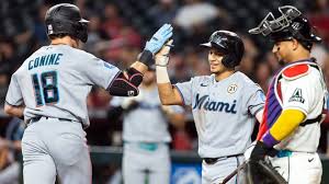 Diamondbacks' Perdomo cut down at the plate in 10th. Marlins win in 11