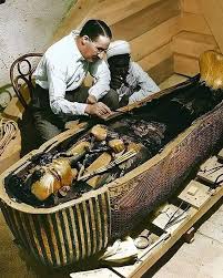 The Archaeologist - Carter and one of the foremen work on the innermost coffin of the Egyptian pharaoh (colorized pH๏τo). The tomb of Tutankhamun was discovered in the Valley of the Kings