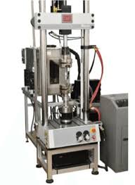 a) MTS Bionix material testing machine, b) the tensile ...