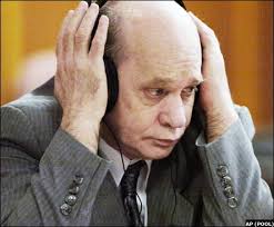 Using headphones, John Couey listened to motions made to state circuit judge Ric Howard during jury ... - 023