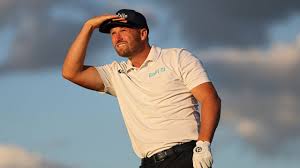Tom Kim playing golf