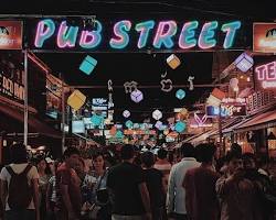 The vibrant, neon-lit Pub Street in Siem Reap at night
