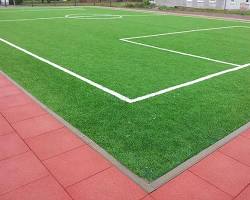 Image of football ground with natural grass flooring