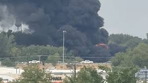 Large plume of black smoke from fire