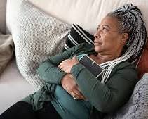 Image of person looking stressed while holding an HOA fee bill