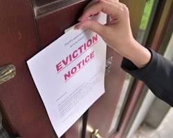 Image of landlord knocking on a door with a rent eviction notice