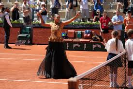 Naomi Osaka’s sequined gold dress at the French Open reminds her of the Eiffel Tower at night