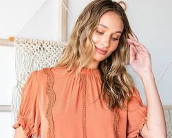 woman wearing a blouse with flounce sleeves