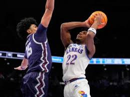 Peterson scores 24 to lead No. 14 Kansas past TCU 78-73 in the Big 12 quarterfinals