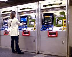 Image of person buying a MetroCard at a New York City subway station