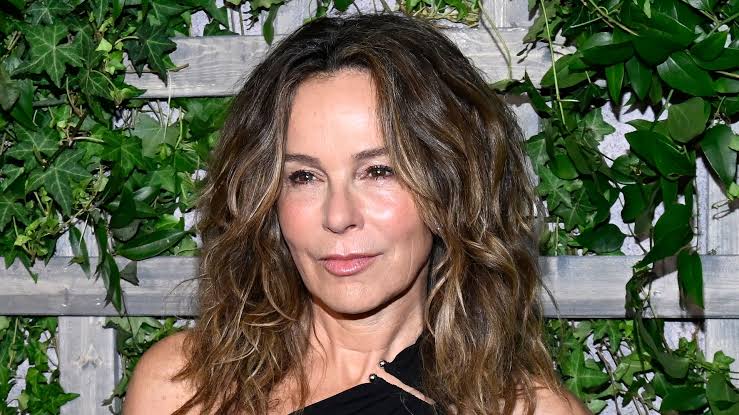 Jennifer Grey, 64, is a youthful beauty in shoulder-baring gown with  tumbling curls