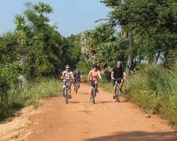 Image of Cyclist on a dirt road in Cambodia