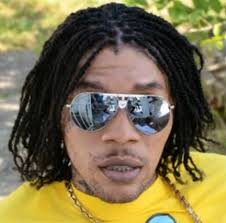 A popular Jamaican dance hall star Adidja Azim Palmer aka Vybz Kartel has been sentenced to life in prison for the murder of a former business associate ... - vybz-kartel-braid-hair-bleach-face