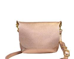 Image of sleek rose gold leather crossbody bag