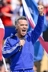 Robbie Williams Speaks Out After White Substance Falls on Mic During World Cup Broadcast