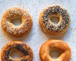 Image of calm and collected New Yorker enjoying a bagel