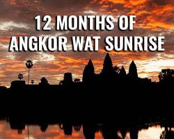 Image of Angkor Wat at sunrise with orange and pink hues