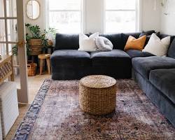 cozy living room with sofa, chairs, and rug