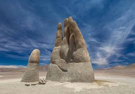 The Hand of the Desert is an 11-meter-tall sculpture located in the Atacama Desert, Chile. Created by Mario Irarrázabal in 1992, it depicts a giant human hand emerging from the sand, symbolizing