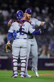 Dodgers closer Michael Kopech and catcher Will Smith embrace after 
clinching the final out in a 4-2 game three World Series win on Monday