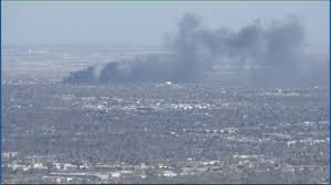 High school, businesses evacuated due to grass fire in Thornton