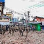 Army holds flag march restive