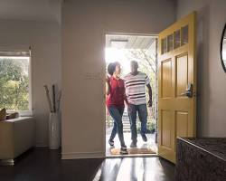 Image of person walking towards a house