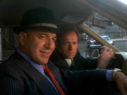 ... slightly befuddled Detective Stavros (George &quot;Demosthenes&quot; Savalas), and anonymous filler detectives Saperstein and Rizzo (Mark Russell and Vince Conti) ... - 1334095821_2