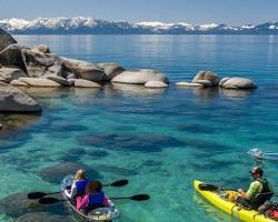 Image of Sand Harbor, Lake Tahoe, with people swimming and kayaking in the crystalclear water
