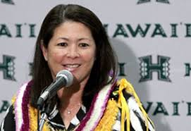 Rainbow Wahine soccer head coach Michele Nagamine at a press conference, with lei. Nagamine - s_soccernagamine