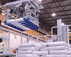 robotic palletizers in a feed mill