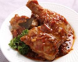 Filipino Chicken Asado (Kapampangan Style) with chicken pieces, tomatoes, and onions