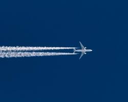 Image of Airplane contrails polluting air