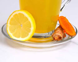 Image of turmeric powder and a cup of turmeric tea