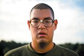 Marine Corps recruit David Briones stands in formation during physical training at Parris Island, South Carolina. Lens (mm): 66, ISO: 400, Aperture: 2.8, ... - 04fig26