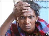 A Tamil woman grieves over lost relatives in last weekend&#39;s massive tsunamis in a makeshift refugee. Victims who are traumatised make easy targets - _40687867_tamilap203