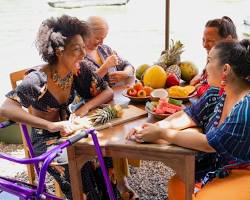 group of friends enjoying colorful acai bowls at an outdoor cafeの画像