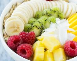 صورة bowl of oatmeal with milk and fruits