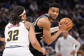 Giannis Antetokounmpo injures leg in closing seconds as Bucks lose to undermanned Nuggets