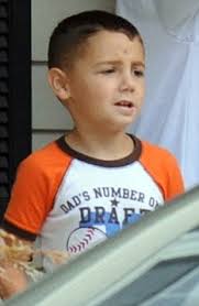 A child in mourning: Five-year-old son of NYPD officer Patrick Luca at the family&#39;s home in Smithtown, after the tragedy. The five-year-old son of a veteran ... - article-2025694-0D6E98C300000578-538_233x358