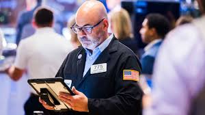 Dow rises more than 200 points to record, Nasdaq falls again as chipmakers struggle: Live updates