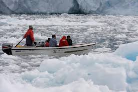 An Inuit family just outside the town of Ilulissat, Greenland. Photo credit: Robert Correll. In addition, innovative co-management regimes allow indigenous ... - Pers_Corell_Figure3.preview