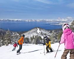 Image of people skiing and snowboarding on a snowy mountain at Lake Tahoe