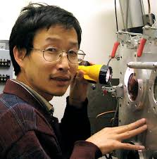 Dr. Zhongwu Wang examines the x-ray optics for the B2 experimental station. Over the past few years Wang had been a regular user of CHESS. - Zhongwu_Wang_B2_Station_DSC00765