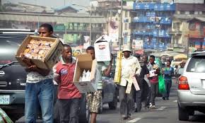 Image result for pictures of beggars and street hawkers in Kaduna