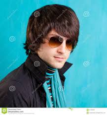 British indie pop rock look retro hip young man with sunglasses on blue. MR: YES; PR: NO - british-indie-pop-rock-look-retro-hip-young-man-24168294