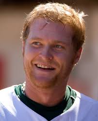 Portrait of Dan Johnson of the Oakland Athletics in the dugout during the game against the Texas Rangers at the McAfee Coliseum in Oakland, California on ... - BMM20027-466x575